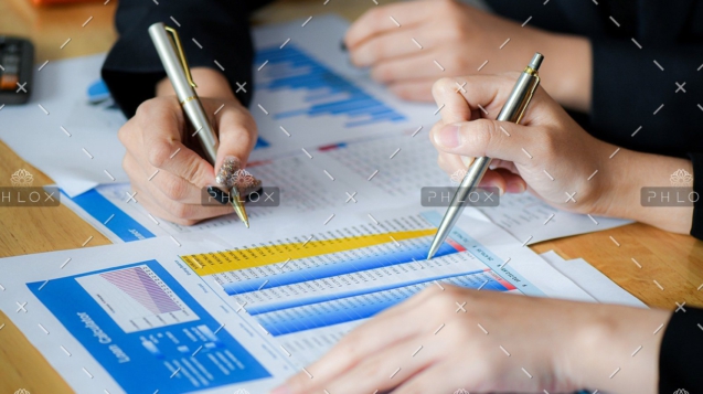 demo-attachment-489-female-office-staff-are-summarizing-the-number-in-6NXGYBK